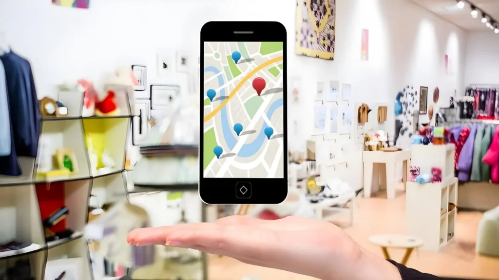 Visibilité locale pour commerces et PME – carte Google Maps affichée sur smartphone dans une boutique